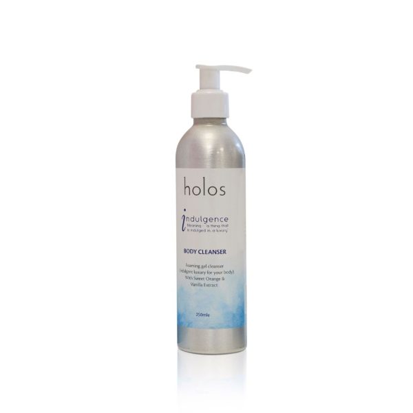 A sleek silver bottle with a pump dispenser, labeled "Holos Skincare Indulgence Body Cleanser," holds 250ml of refreshing goodness. The design showcases a white label with blue accents, highlighting the sweet orange and vanilla extract for a delightful cleansing experience.