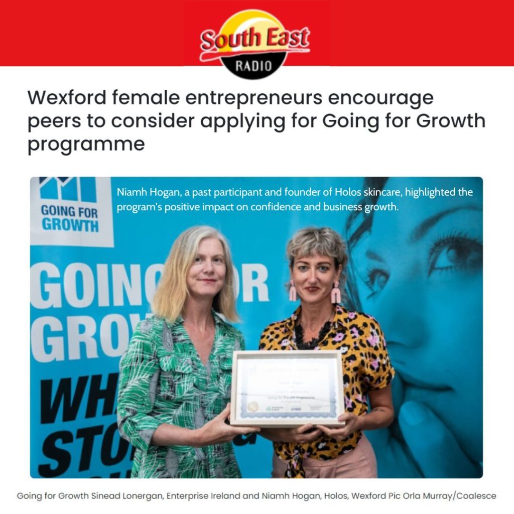 Two women, with Niamh Hogan holding a certificate, stand in front of a "Going for Growth" backdrop. The image highlights female entrepreneurship in the Going for Growth program, proudly supported by South East Radio and Holos Skincare.